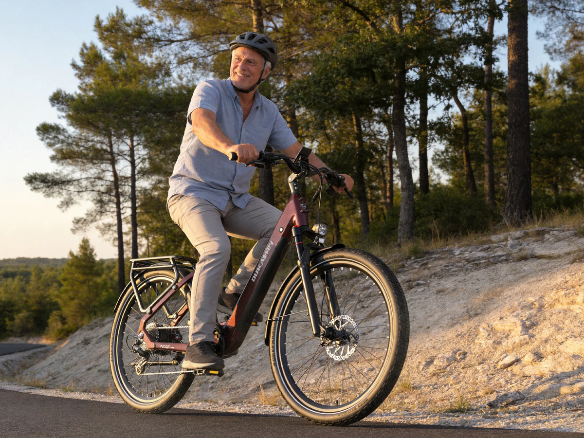 Man riding a red Dukawey FUGL Pro on a gravel path